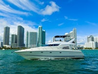 a white boat is in the water