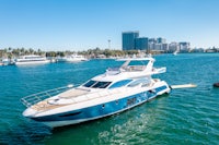a blue and white boat is docked in a body of water