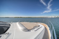 a view of a boat on the water with a skyline in the background