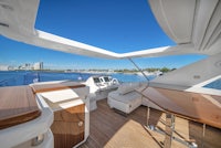 the interior of a luxury yacht with a table and chairs
