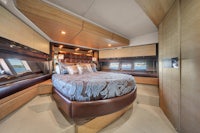 a yacht with a bed in the middle of the room
