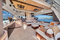 the interior of a luxury yacht with couches and a coffee table